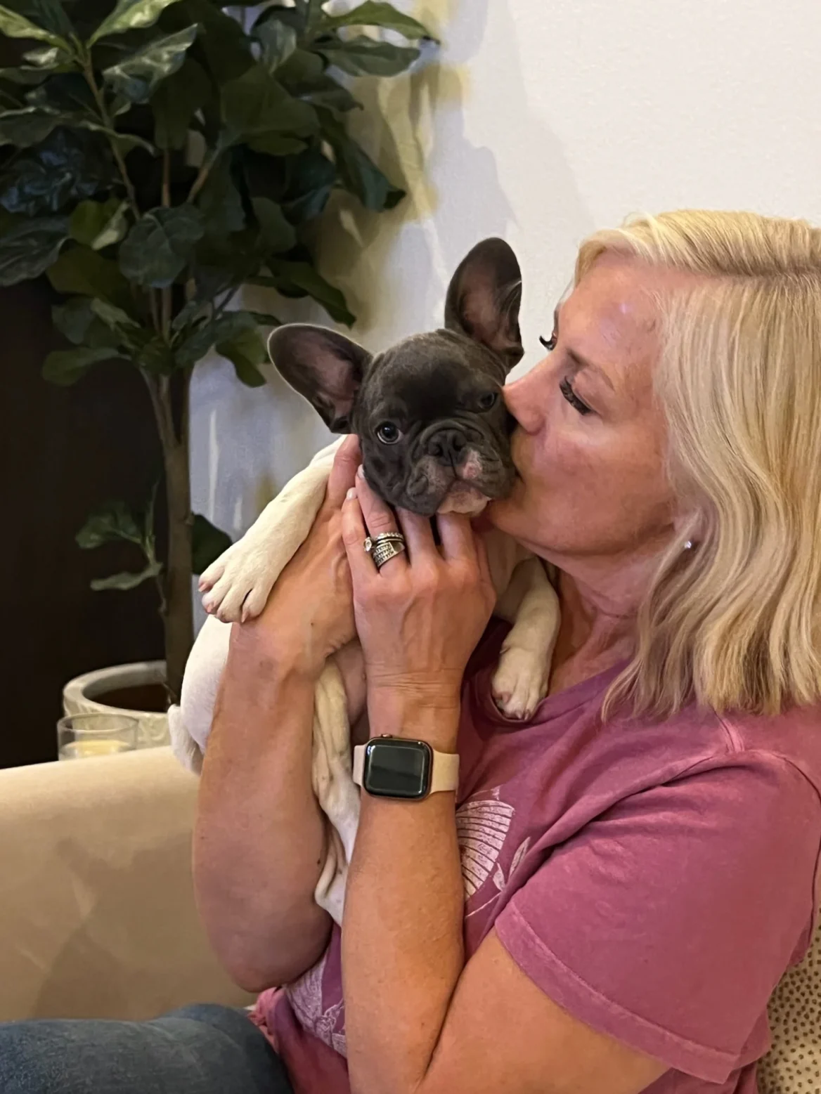 Kim Rogers holding her Frenchie